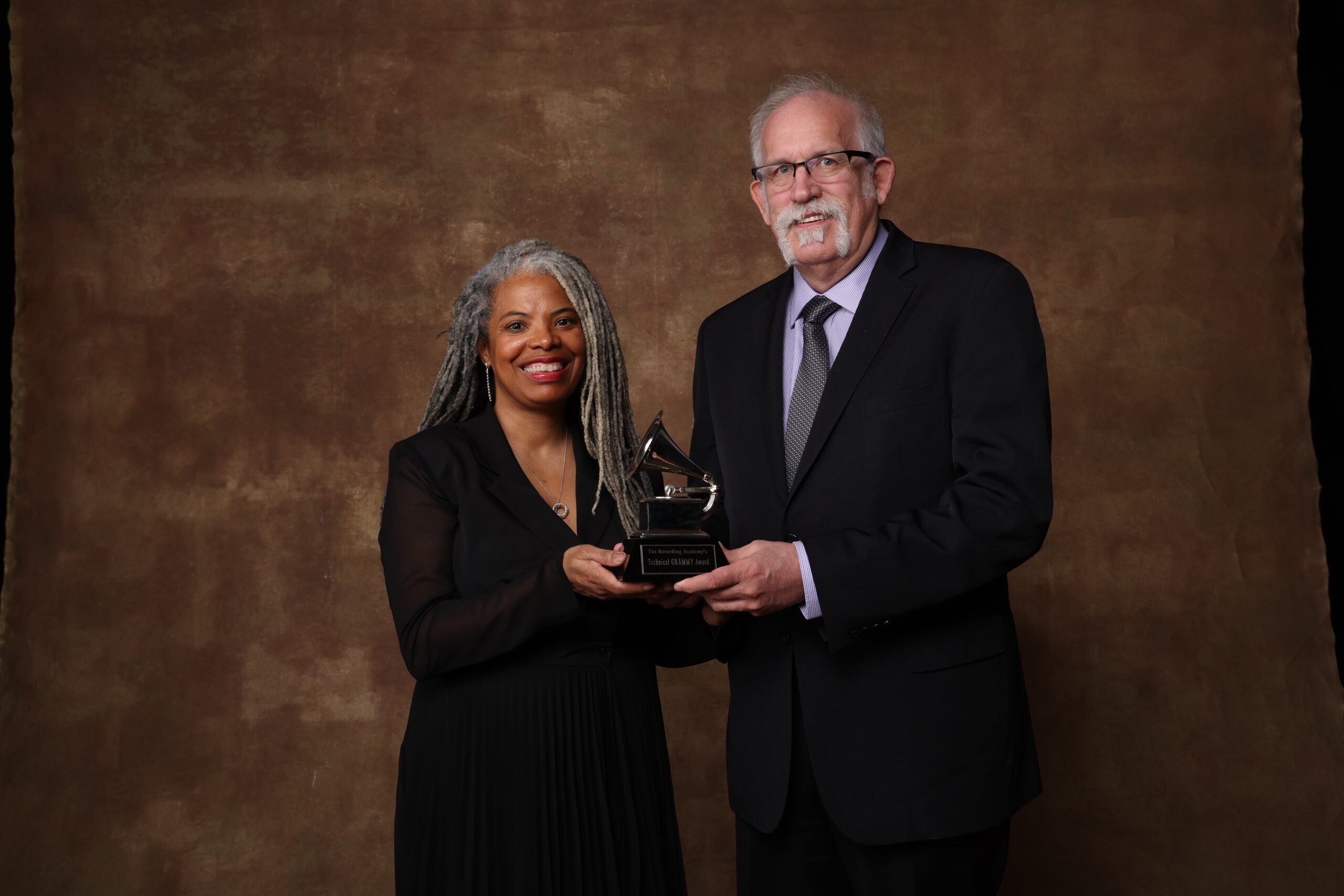 AES President-Elect Leslie Gaston-Bird (left) and President Bruce Olson accepted a Technical GRAMMY® Award on behalf of the Audio Engineering Society during the GRAMMY® Week celebration in February 2023. Photo by Getty Images for the Recording Academy.